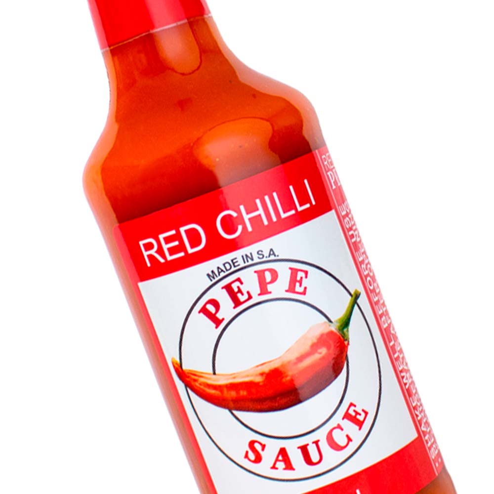 pepe redchilli zoom sml Pepe Sauce - Red Chilli flavour hot sauce with bold, spicy taste. Close up.