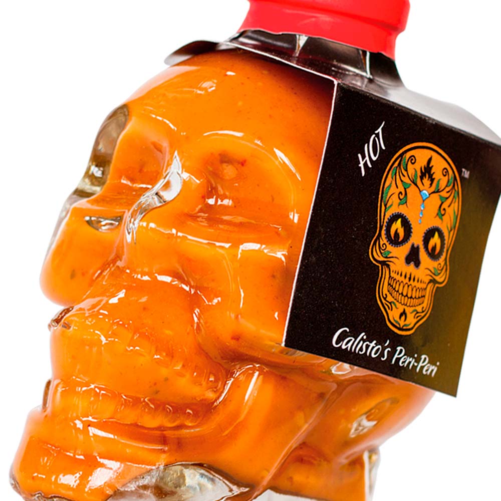 skullhot zoom sml Calisto’s Skull Peri-Peri Sauce - Hot - fiery peri-peri sauce for serious chilli lovers. Close up.